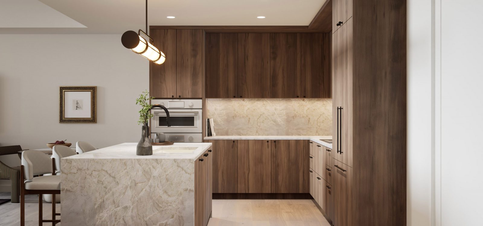 Sleek kitchen with high-end finishes, featuring a large marble countertop, modern cabinetry, and stainless steel appliances.