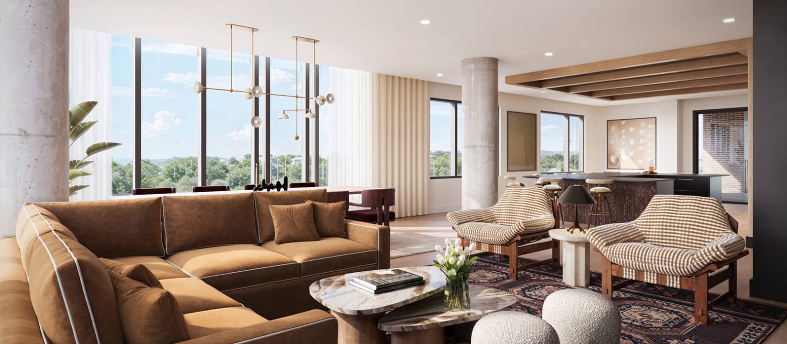 Spacious living room with brown leather seating, patterned rug, modern coffee tables, and large windows showcasing panoramic views of the surrounding area.